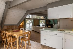a kitchen and dining room with a table and chairs at Arrowhead Escape in South Lake Tahoe