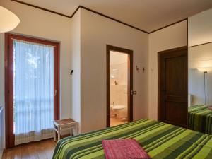 A bed or beds in a room at Apartment Hermitage-19 by Interhome