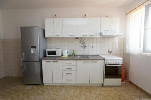 Kuchyň nebo kuchyňský kout v ubytování Apartment Davorka