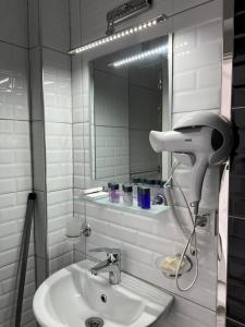 A bathroom at White Suite Rooms