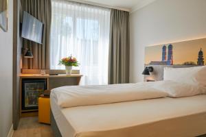 Postel nebo postele na pokoji v ubytování Hotel Concorde