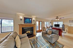 a living room with a couch and a fireplace at Highland Oasis in Cloverdale