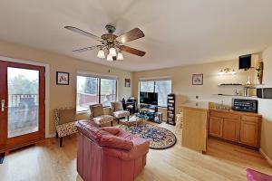 a living room with a couch and a ceiling fan at Highland Oasis in Cloverdale