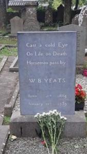 a grave sign in a cemetery with a plant at The Nook in Tawnyinah