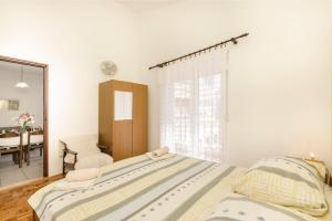 Posteľ alebo postele v izbe v ubytovaní Apartments and Room Lotus