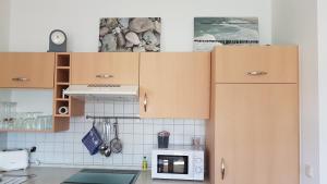 Kuchyň nebo kuchyňský kout v ubytování Ferienwohnung Nr 5 am Weststrand - 4 Sterne DTV