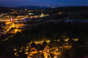 an aerial view of a city at night at Rezydencja Boutique SKI - 200m do Term Bania, Odkryj-Bialke in Białka Tatrzańska