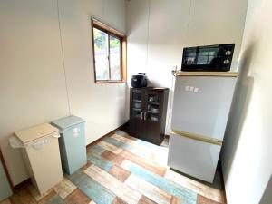 Kuchyň nebo kuchyňský kout v ubytování 「西の横綱」俵山温泉で極上の湯治STAY。物語が始まる場所 -MUKU-