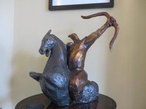 a statue of a person riding a horse at Hewlett Apartments in Cheltenham