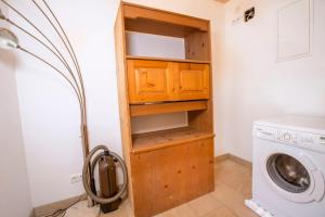 a laundry room with a washer and dryer at Haus Rendl 1 in Bramberg am Wildkogel