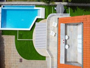 a rendering of a swimming pool next to a house at Villa Vita,free wifi,nearby sea in Opatija