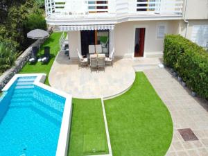 a house with a swimming pool and a lawn at Villa Vita,free wifi,nearby sea in Opatija