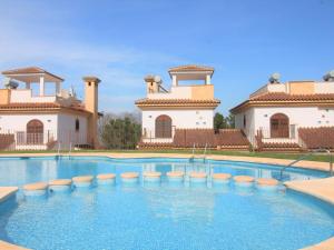 The swimming pool at or close to Holiday Home Flor de Ponoig by Interhome