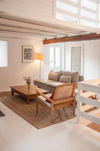 a living room with a couch and a table at CASA TON, junto a Baqueira y Aigüestortes in Sorpe