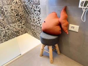 a stuffed animal sitting on top of a stool at Villa Rosalba in Polignano a Mare