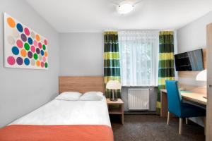 Posteľ alebo postele v izbe v ubytovaní Hotel Petrus