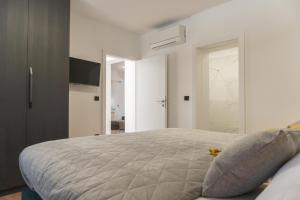 Postel nebo postele na pokoji v ubytování Apartman Sorelle