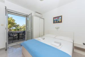 Posteľ alebo postele v izbe v ubytovaní Apartments M&A