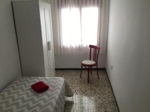 Łóżko lub łóżka w pokoju w obiekcie Casa Collado