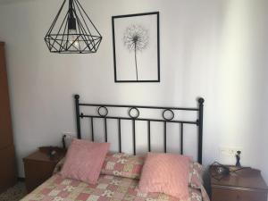 Łóżko lub łóżka w pokoju w obiekcie Casa Collado