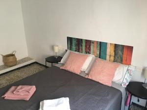 Łóżko lub łóżka w pokoju w obiekcie Casa Collado