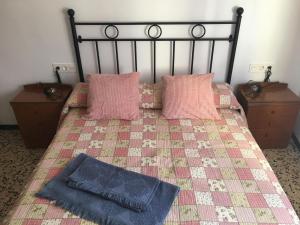 Łóżko lub łóżka w pokoju w obiekcie Casa Collado