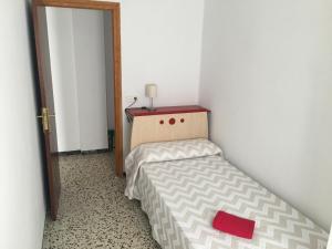 Łóżko lub łóżka w pokoju w obiekcie Casa Collado