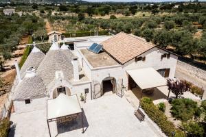 an overhead view of a white house with a roof at Trulli Nuova Aia Resort in Alberobello