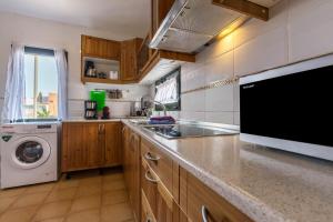 A kitchen or kitchenette at Villa Orquidea