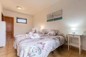 A bed or beds in a room at Villa Orquidea