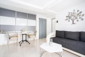 a living room with a couch and a table at Apartment Tina in Vrh