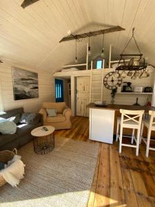 a living room with a couch and a table at Westergårds in Föglö