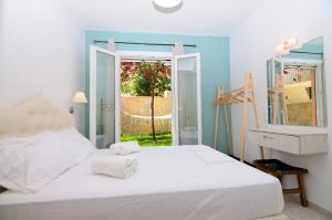 Posteľ alebo postele v izbe v ubytovaní Villa Ektoras by EY Villas + 29 fotografií