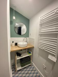 a bathroom with a sink and a mirror at Mont gozzi in Ajaccio