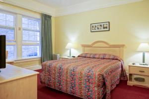 Katil atau katil-katil dalam bilik di Grant Hotel