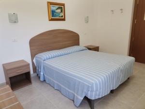 מיטה או מיטות בחדר ב-Hotel Ponte