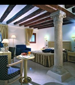 En eller flere senge i et værelse på Hotel Giudecca Venezia