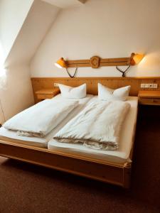 Krevet ili kreveti u jedinici u okviru objekta Hotel Stadt Olbernhau
