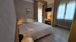 Posteľ alebo postele v izbe v ubytovaní Hotel Bel Sito Peschiera