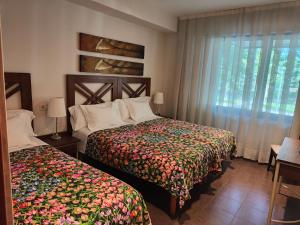 Кровать или кровати в номере La Ciudadela