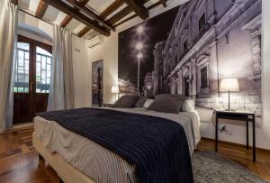 Postel nebo postele na pokoji v ubytování Cassandra Charme Apartment by Ortigiaapartments