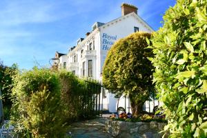 a white building with a sign on it at Royal Beacon Hotel in Exmouth