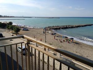 a view of a beach with people on the sand at Olga’s house in Cariati