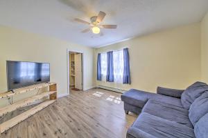 a living room with a couch and a flat screen tv at Bright Bingham Apt Hunt, ATV and River Raft! in Bingham