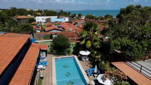 an aerial view of a resort with a swimming pool at Catavento da Pipa in Pipa
