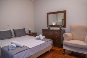 Llit o llits en una habitació de Aiolos Apartment