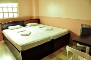 Postel nebo postele na pokoji v ubytování GV Hotel - Camiguin