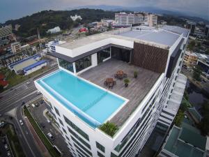an overhead view of a building with a swimming pool at Sky Hotel in Kota Kinabalu