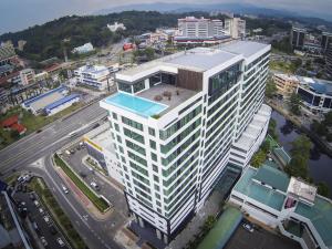 an overhead view of a tall white building at Sky Hotel in Kota Kinabalu
