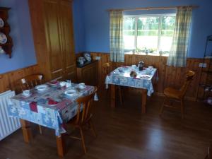 a dining room with two tables with presents on them at Manorview B&B in Cookstown